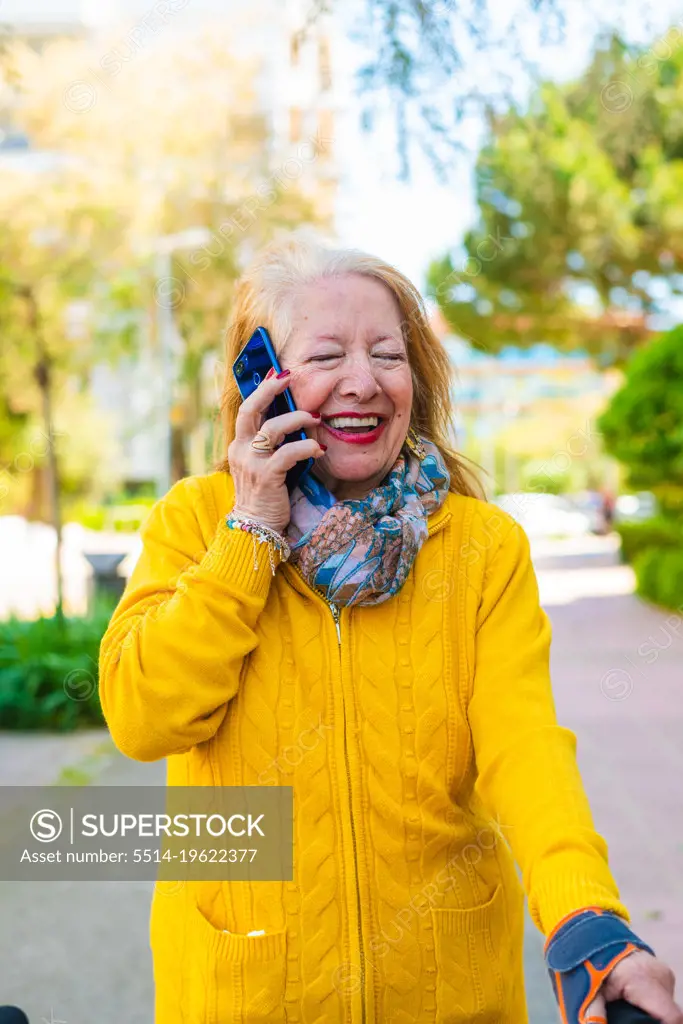 80-year-old woman using a mobile phone