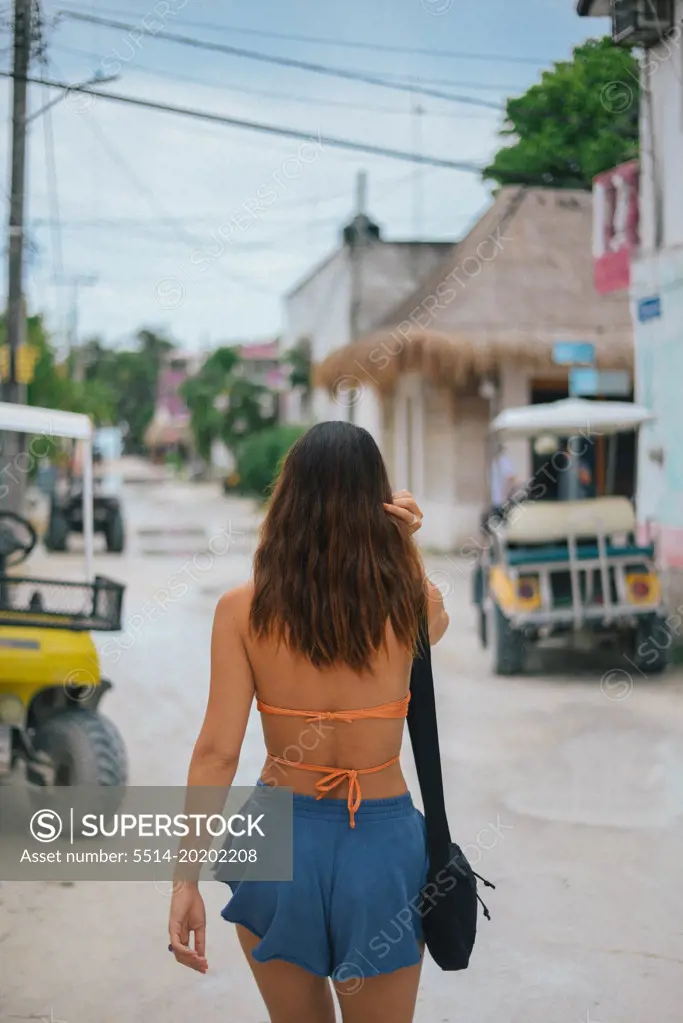 girl walking on the little town streets