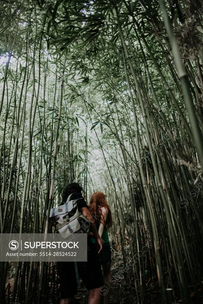 A man and woman exploring wild Hawaii