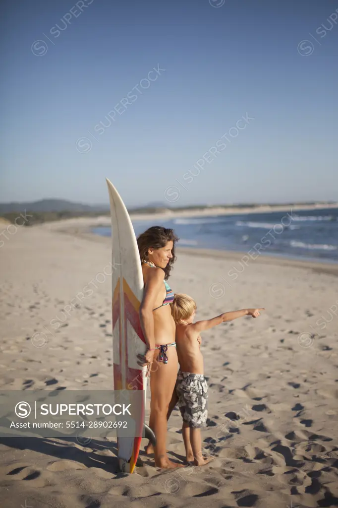 Boy showing something to his mother at the beach, Viana do Castelo, Norte Region, Portugal