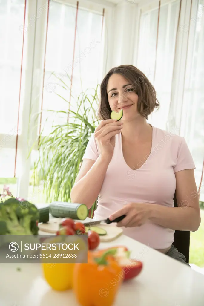 Eating pregnant woman preparing healthy lunch