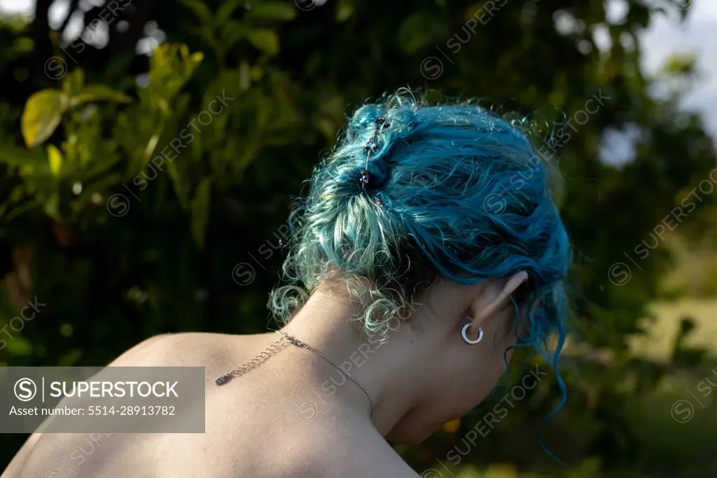 Bare Back Of Blue Haired Girl Wearing Necklace
