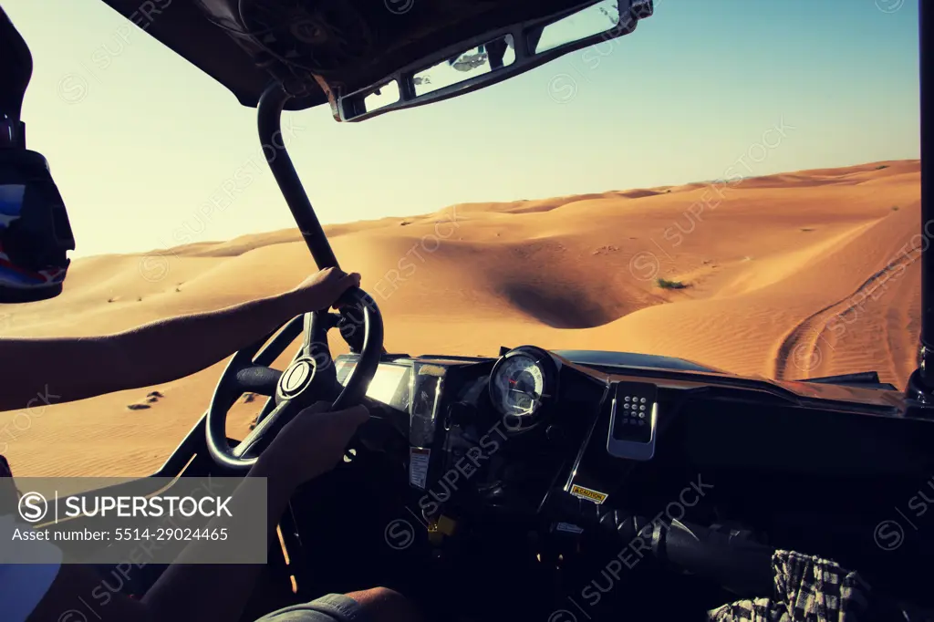 Driving quad bike, buggy at Dubai desert sand dunes