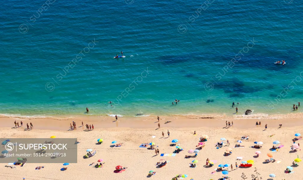 Aerial view from a Tropical beach with colorful umbrellas.