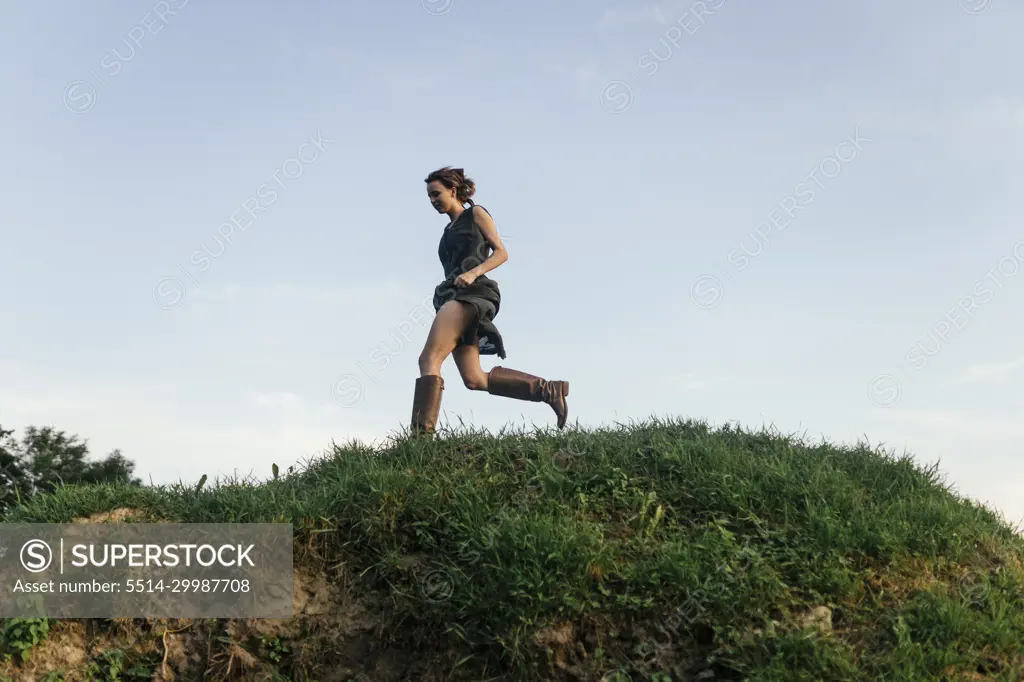 Woman runs down the hill