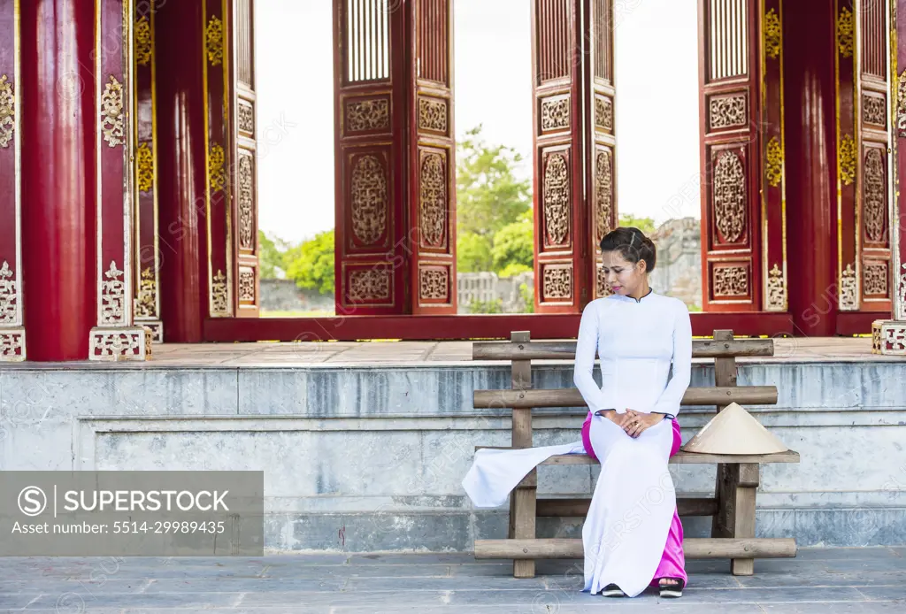 beautiful woman exploring the imperial palace in Hue / Vietnam