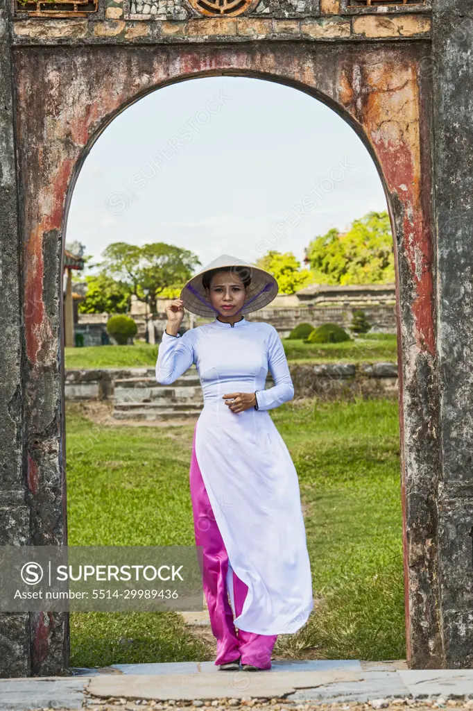 beautiful woman exploring the imperial palace in Hue / Vietnam