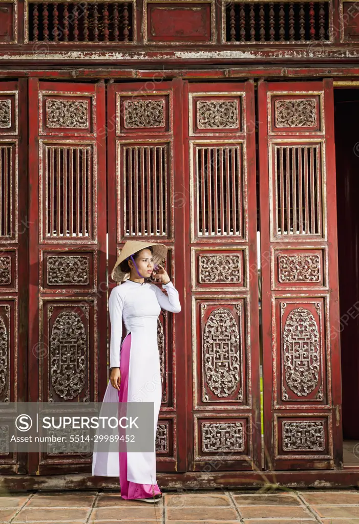 beautiful woman exploring the imperial palace in Hue / Vietnam