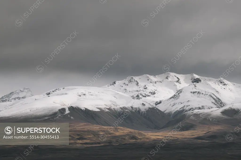 Rugged alpine mountains with snow capped peak South Island New Zealand