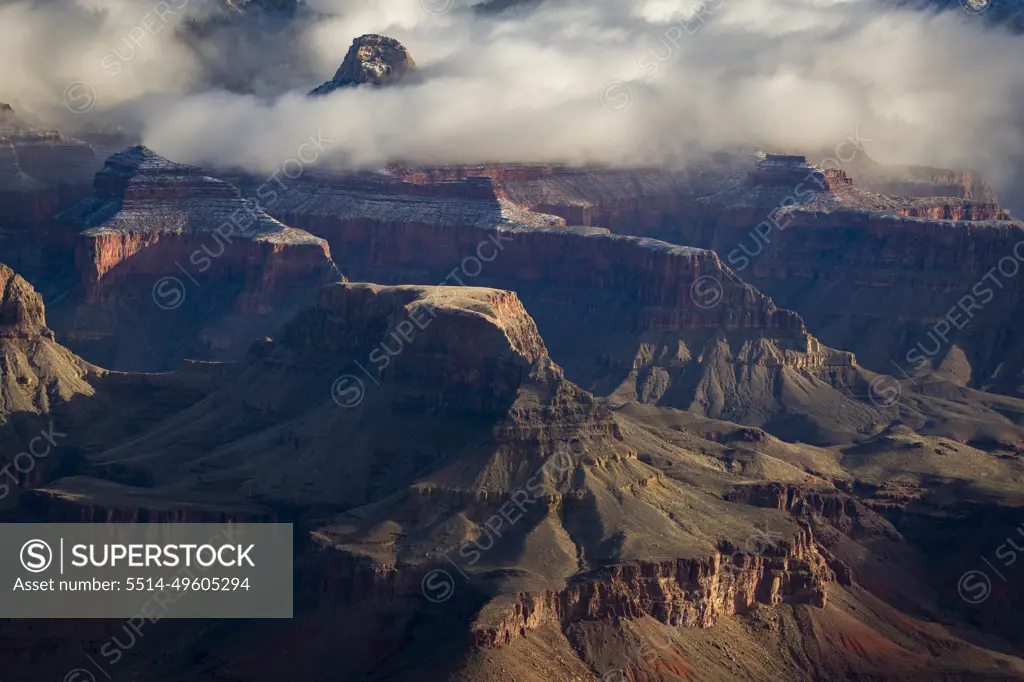 Rock formations shrouded in clouds at the Grand Canyon in winter