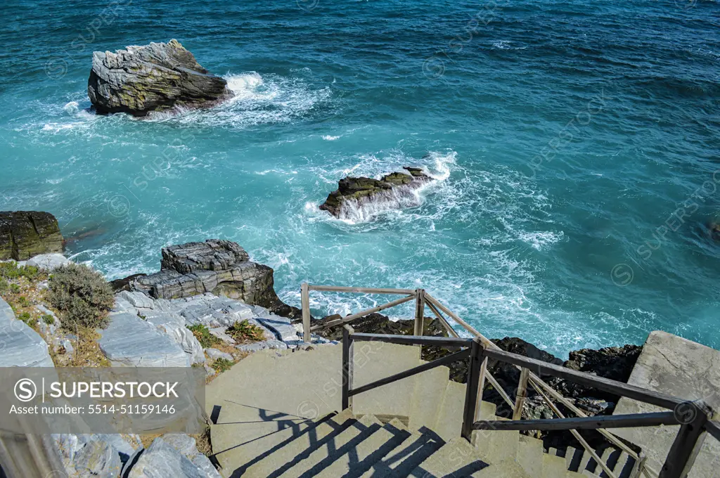 Beach and blue sea with cliffs in Greece