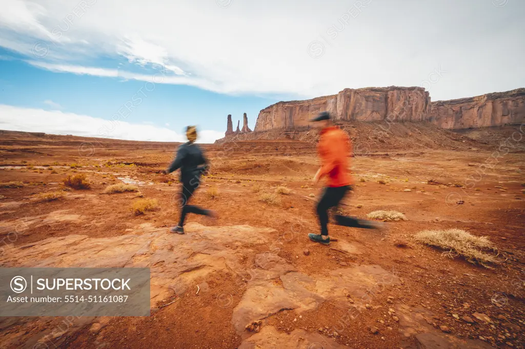 Couple Trail Running Monument Valley Red Dirt