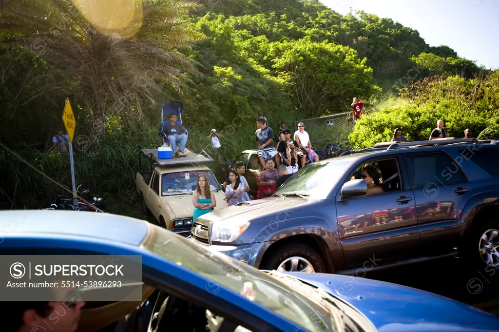 Scene at the 25th Eddie Aikau Big Wave Invitational. Biggest swell on the North Shore for 10 years brought in 30-50 foot waves at Waimea Bay on the North Shore of Hawaii. Haven't h