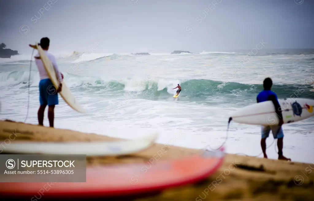 Surfer scene a day before the 25th Eddie Aikau Big Wave Invitational. The biggest swell on the North Shore for 10 years brought 30-50 foot waves to Waimea Bay, Hawaii.