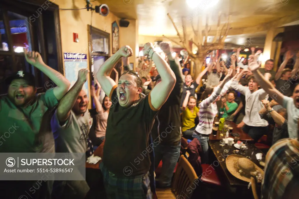 Crowds of spectators watch the World Cup match between England and the USA at a pub in Boulder, Colorado.