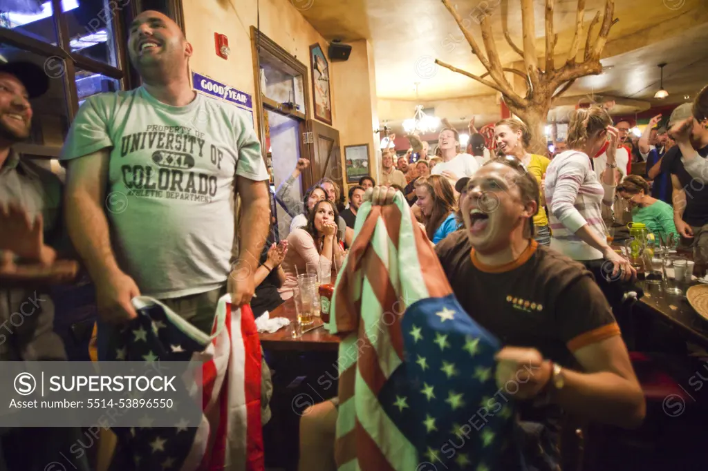 Crowds of spectators watch the World Cup match between England and the USA at a pub in Boulder, Colorado.