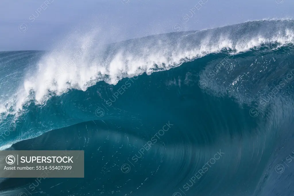 Close up of a huge and powerful wave breaking in Tahiti