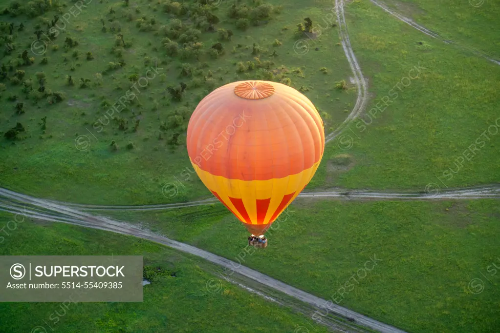 Hot air balloon viewed from above, over the Maasai Mara in Kenya