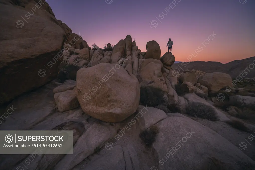 Climbing Boulder in Joshua Tree