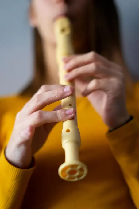 Woman music and music teacher playing flute.