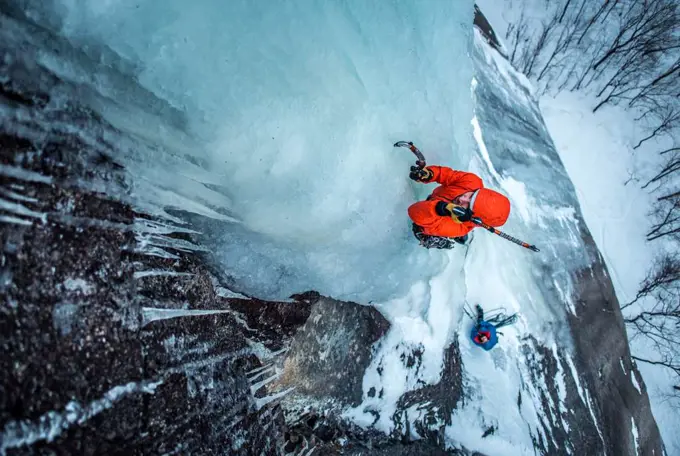 Man ice climbing on Cathedral Ledge in North Conway, New Hampshire