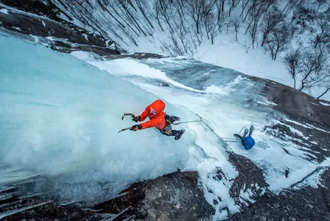 Man ice climbing on Cathedral Ledge in North Conway, New Hampshire