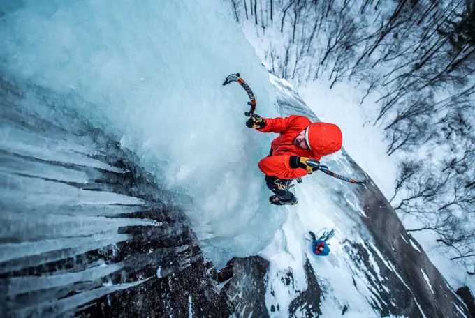 Man ice climbing on Cathedral Ledge in North Conway, New Hampshire