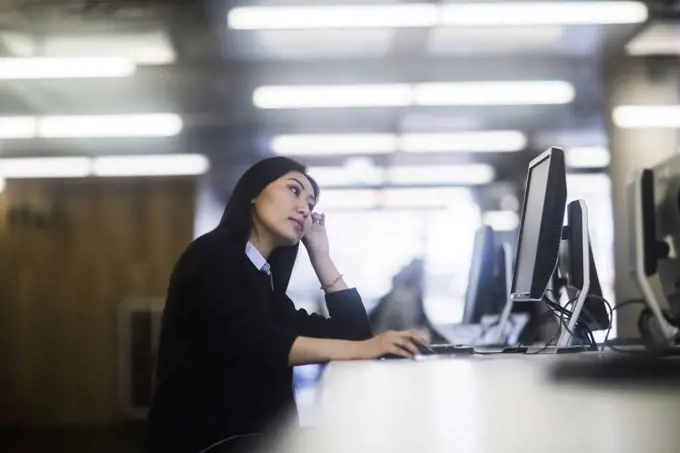 young asia woman with paper in an office working