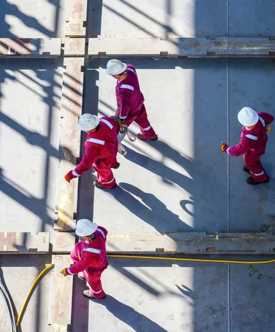 Shipyard maintenance workers onboard offshore oil platform