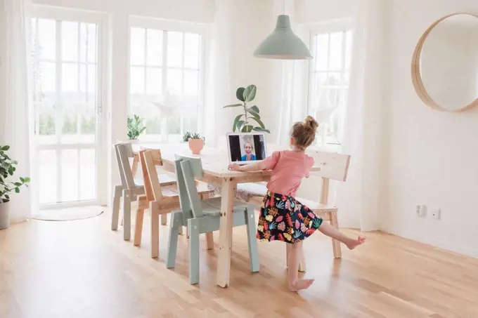 girl having a video call with a nurse in hospital dancing for her