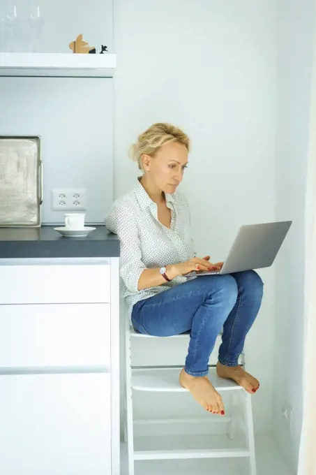 Women working at home with Laptop. Home office