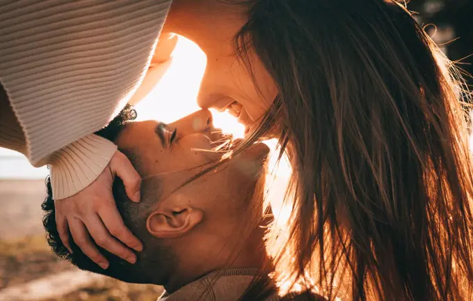 Lovely Shot Of A Young Couple In Love At Sunset