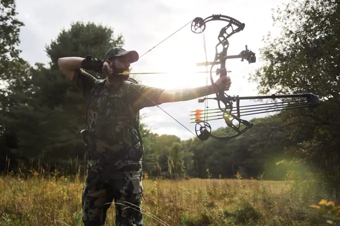 Bow Hunter drawing his bow in the Appalachian Mountains