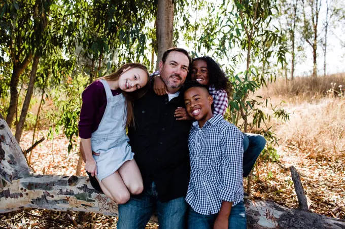 Dad & Kids Hugging & Smiling for Camera at Park in Chula Vista