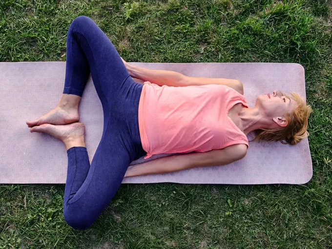 Female athlete stretching pelvis and hips