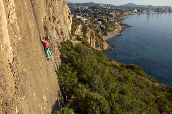 Female rock climber in Toix Est, Calpe, Costa Blanca, Alicante Province, Spain