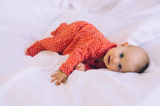 a baby in the bed