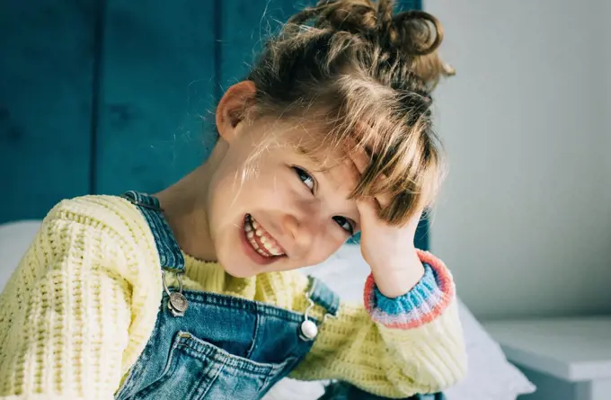 candid portrait of a beautiful young girl smiling full of happiness