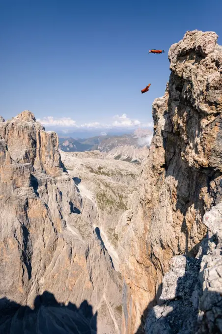 Wingsuit Base Jumpers jumping off a mountain