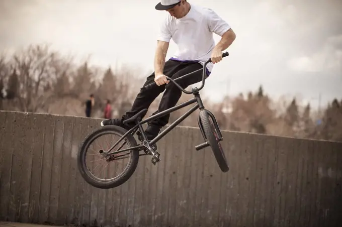 Young bmx rider trying to land trick