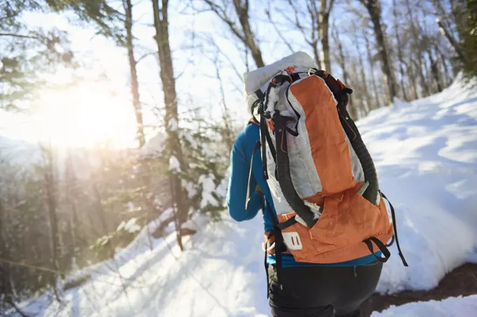 Male ice climber hiking up to Mount Washington, New Hampshire