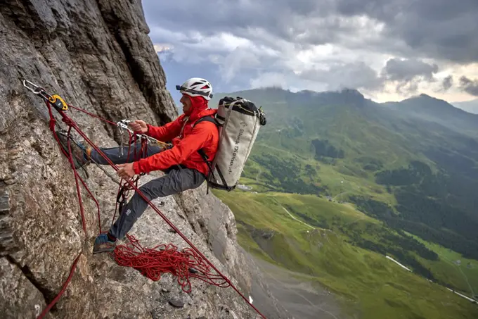 Jacopo Larcher hauling bags climbing the Eiger North Face, Switzerland