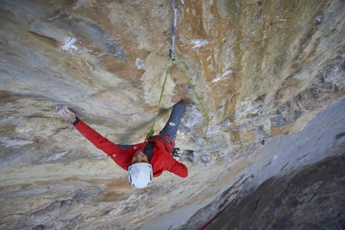 Man on a difficult rock climb called Odyssee on the Eiger North Face