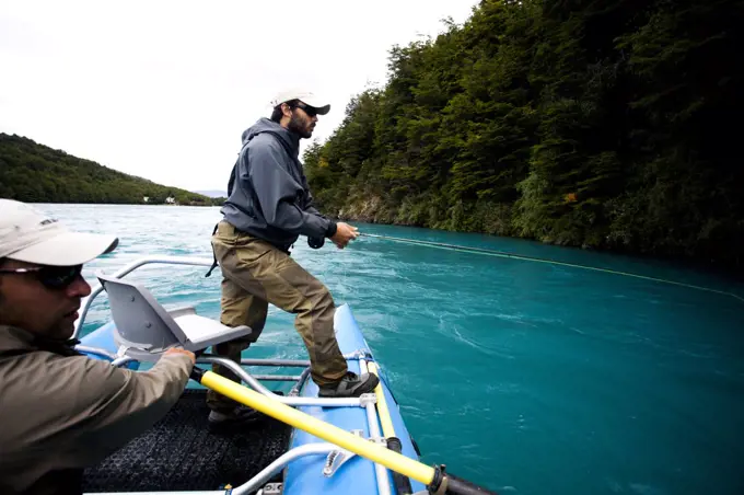 Two fisherman float down the Rio Baker in southern Chile in a region called Patagonia.