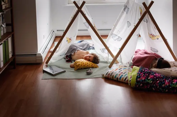 Two sleeping kids inside in tents