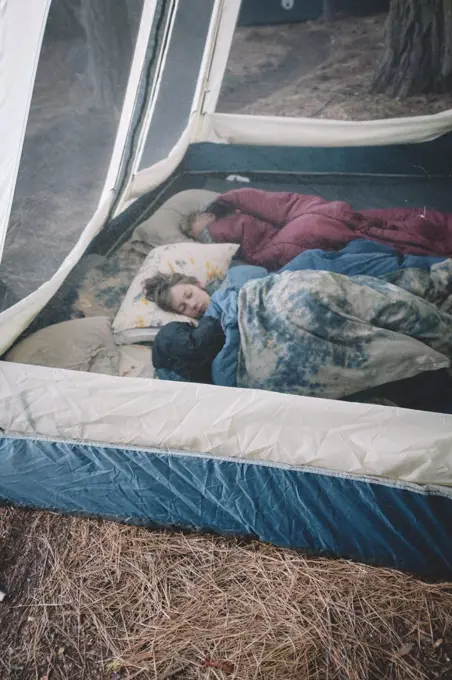 Two Boys Sleeping and cozy  in Fancy Camping Tent