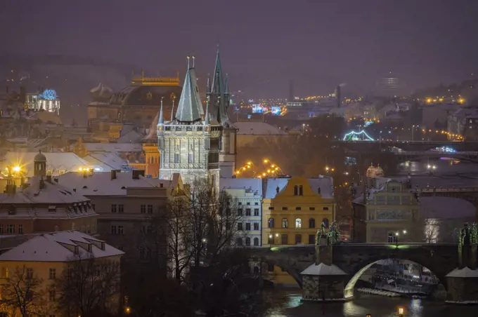 Old Town Bridge Tower, National Theatre and Charles bridge at night in winter, Prague, Czech Republic