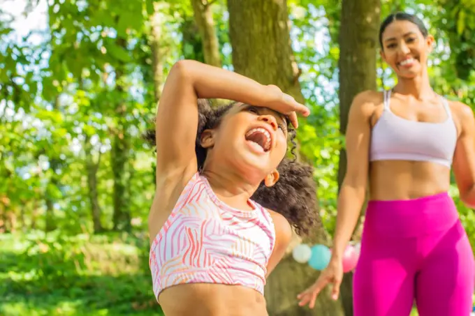 Child laughs after yoga stretch