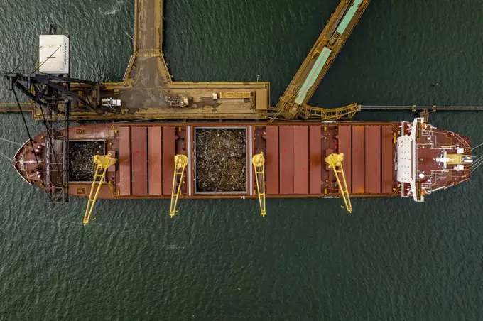 Aerial view of a cargo ship loaded with scrap metal