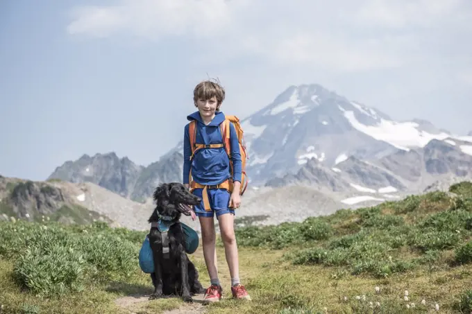 A boy and his dog hiking in Glacier Peak Wilderness.